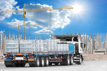 Truck transport heavy material for construction at building under construction