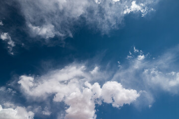 Blue sky with puffy white clouds