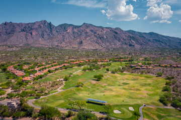 Golf course in Tucson Arizona Catalina Foothills with mountains in distance - obrazy, fototapety, plakaty