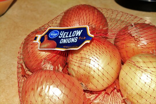 Kroger Yellow Onions Shot Closeup On A Counter Top In Hutchinson Kansas USA In A Bag.