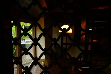 Living Room View through Vintage Wrought Iron Fence or Metal fence - アンティーク 鉄のフェンス リビングルーム