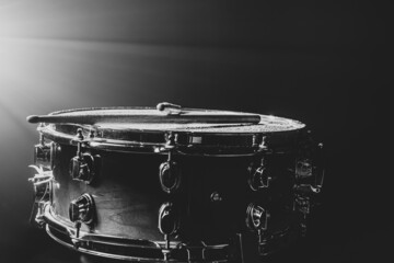 Snare drum on a black background, musical instrument, musical concept.