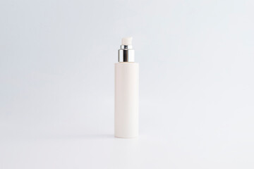 blank cosmetic pump top silver bottle mock up on background with copy space