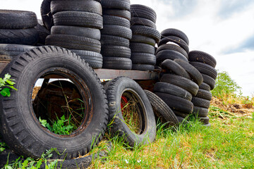 Heap of old used tires in pile