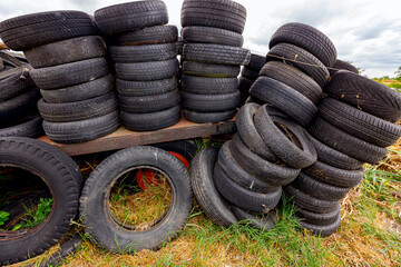 Heap of old used tires in pile