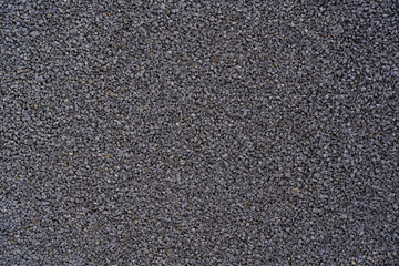 Black rubber coating made of recycled rubber chips on the sports field.Top view