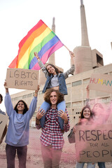 Vertical photo of cheerful gay pride and LGBT demonstration. Activist group os people supporting...