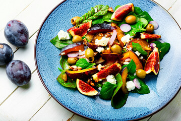 Autumn salad with fruit and green