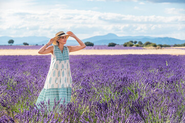 White haired woman with hatin the lavender fields