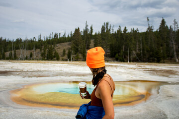 Adventurous Girl exploring the outdoors with blaze orange hat and vibrant blue jacket. 