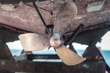 Old ship propeller screw close up background.