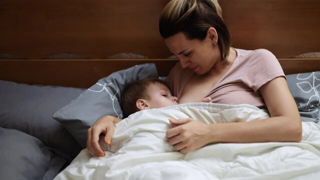 Mom breastfeeds 3 year old son
