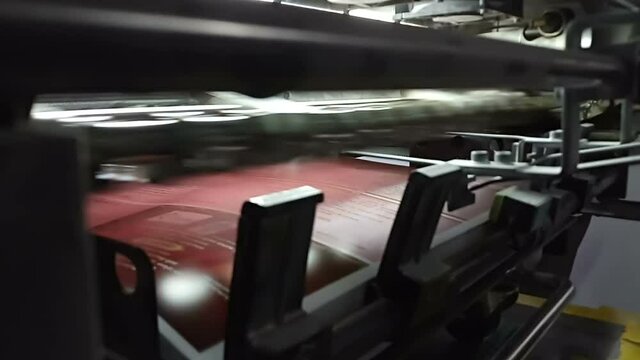 A modern four colour printing machine running in high speed. Shot at Kolkata, West Bengal, India.