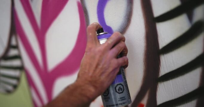 spray painting a wall mural