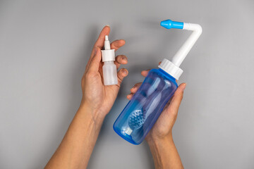 Spray and bottle for rinsing the nose - obrazy, fototapety, plakaty