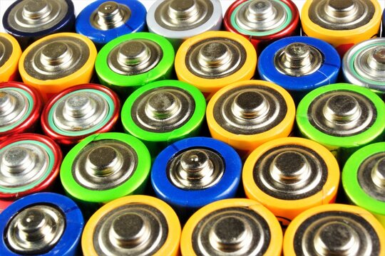 AA batteries. Batteries for electrical devices. An assortment of finger multi-colored ones.