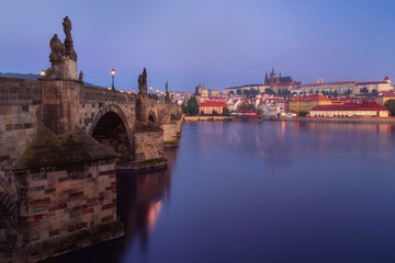 Beautiful view over Charles Bridge (Karluv Most) and Prague Castle (Hrad) on a sunrise in Prague, Czech Republic
