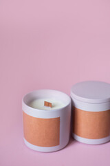 wooden wick candles. Handmade candle made of paraffin and soy wax in a ceramic bowl. Making candles. two pink candles