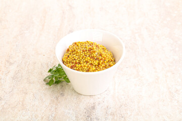 Grain mustard sauce in the bowl