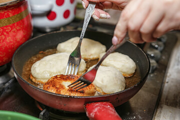 Traditional home Russian cuisine - fried in oil pies with potatoes