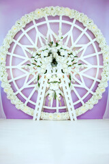 Festive cart with lollipops, cupcakes, cake, flowers. Bar with sweets. Copy space for text