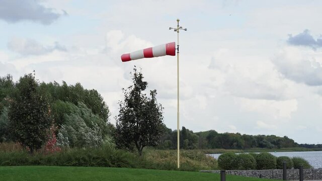 red and white flag. Wind designator to indicate direction of wind on helipads