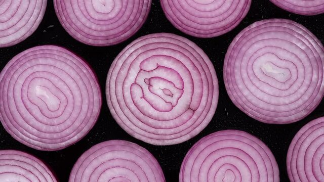 Sliced purple onion top view, rotation. 4K UHD video