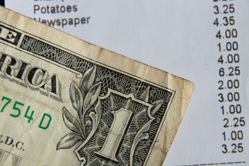 a check from the supermarket is on the table, a paper check with purchases, finances