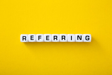 White block with referring word