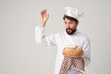 Baker with bread in hand culinary industry