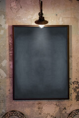 empty black board hanging on the wall