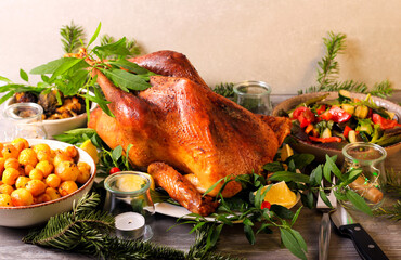 Festive dinner with roast wild turkey and other dishes served - obrazy, fototapety, plakaty