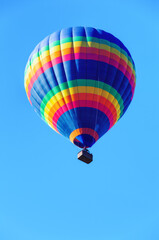 Colorful air balloon on blue sky background