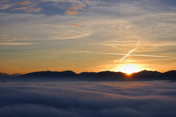 Sunset over fog in the mountains