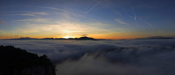 Sunset over fog in the mountains