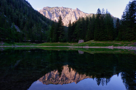Calm lake in the alps in the evening with nice reflection
