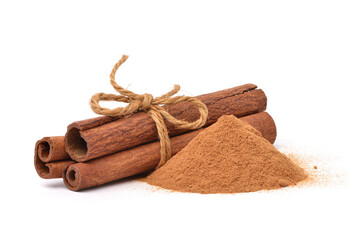 Aromatic cinnamon powder with sticks on white background.