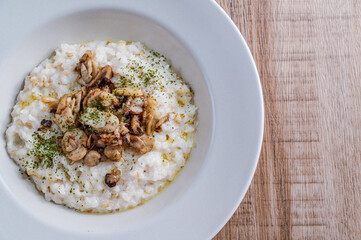 Mushroom risotto in a white bowl
