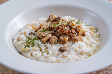 Mushroom risotto in a white bowl