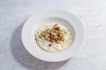 Mushroom risotto in a white bowl