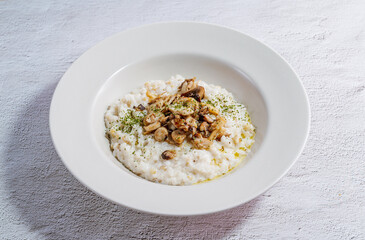Mushroom risotto in a white bowl