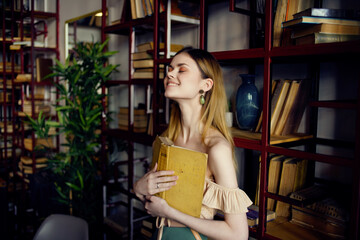 cheerful woman sitting at a table with a drink in a cafe Lifestyle