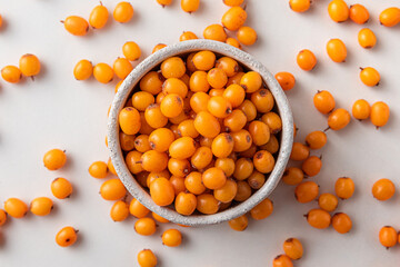 Sea buckthorn berries on white background. Healthy superfood. Top view