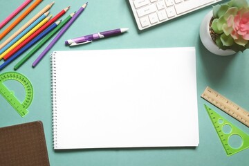 School desk with supplies picture top view. White empty album sheet, pen, pencils, ruler. Education concept flat lay photography