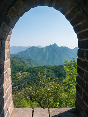 Obraz premium see through from window of a watchtower from the great wall of China at Mutianyu near Beijing, China, Asia, stock photography
