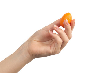 Kumquat in hand isolated on a white background photo