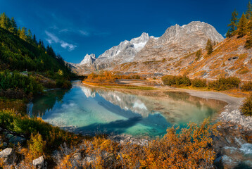 Autumn colors in the wild Val Veny with lake in foreground, Aosta Valley, Italy - obrazy, fototapety, plakaty
