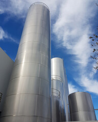Madrid, Spain 06/14/2019: large aluminum storage tanks of a modern factory