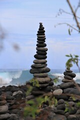 Creativ stone pyramid with blurred sea in the background, Santa Cruz de Tenerife