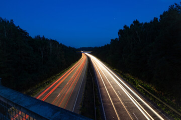 light trail with train in background